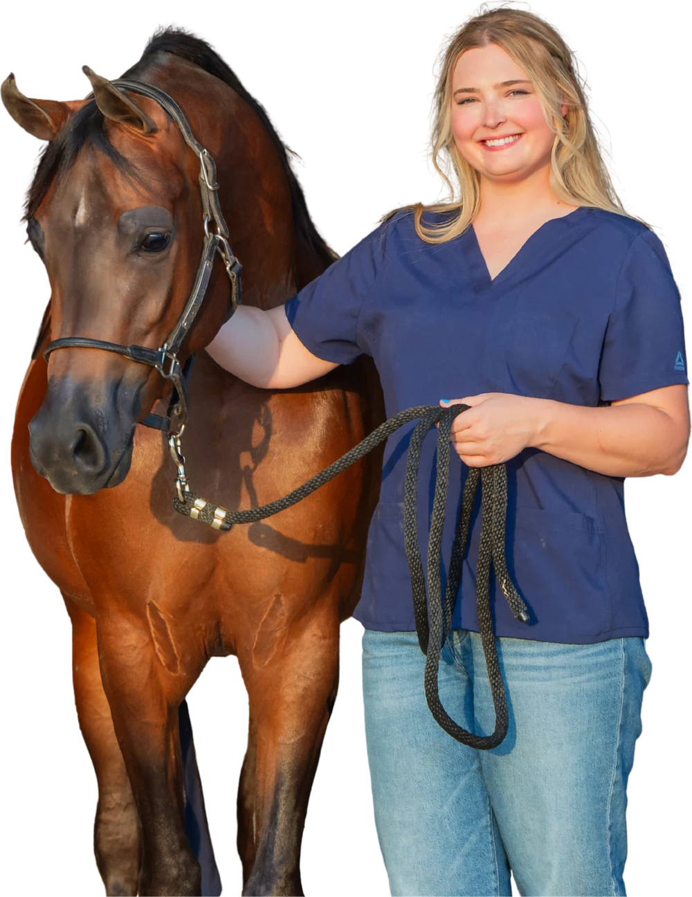 Dr. Kianna Spencer standing beside a bay horse.